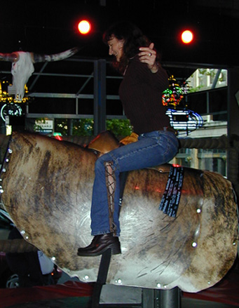 Riding the mechanical bull at Cowgirls Inc