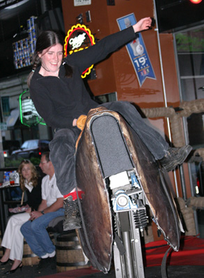 Riding the mechanical bull at Cowgirls Inc