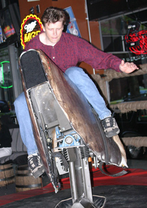 Riding the mechanical bull at Cowgirls Inc